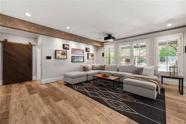 5330 Lake Redwine Cv NW, Acworth, GA 30101 - living room with a barn door, recessed lighting, light wood-style floors, baseboards, and beam ceiling