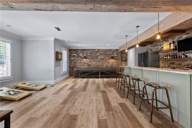 5330 Lake Redwine Cv NW, Acworth, GA 30101 - indoor bar featuring high end refrigerator, brick wall, wood finished floors, decorative light fixtures, and baseboards