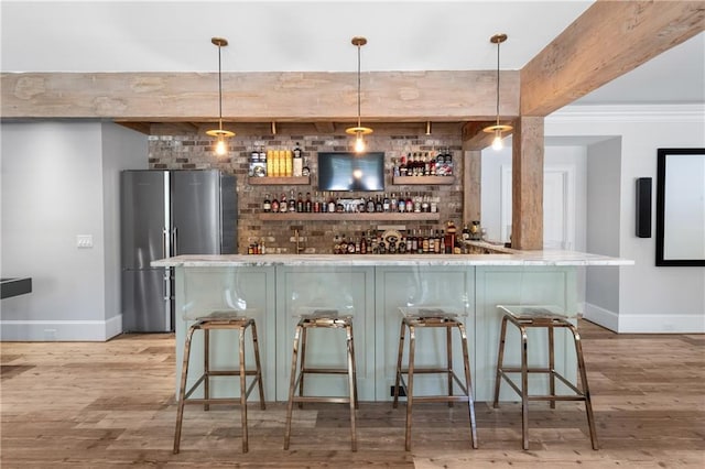 5330 Lake Redwine Cv NW, Acworth, GA 30101 - indoor bar featuring freestanding refrigerator, baseboards, light wood-type flooring, and pendant lighting