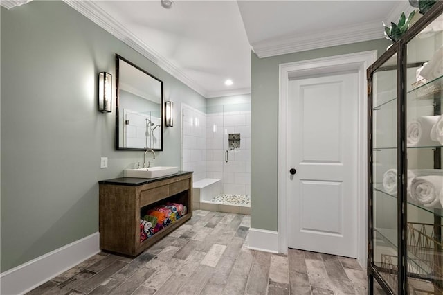 5330 Lake Redwine Cv NW, Acworth, GA 30101 - bathroom featuring a tile shower, ornamental molding, baseboards, vanity, and recessed lighting