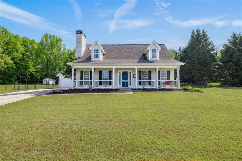 48 Austin Way, Jefferson, GA 30549 - view of front of house with a chimney, fence, a front lawn, driveway, and a porch