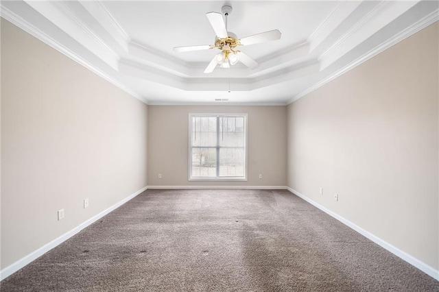 unfurnished room featuring crown molding, ceiling fan, a raised ceiling, and baseboards