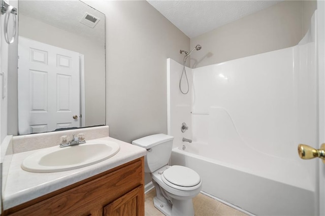 full bath with visible vents, bathing tub / shower combination, toilet, a textured ceiling, and vanity