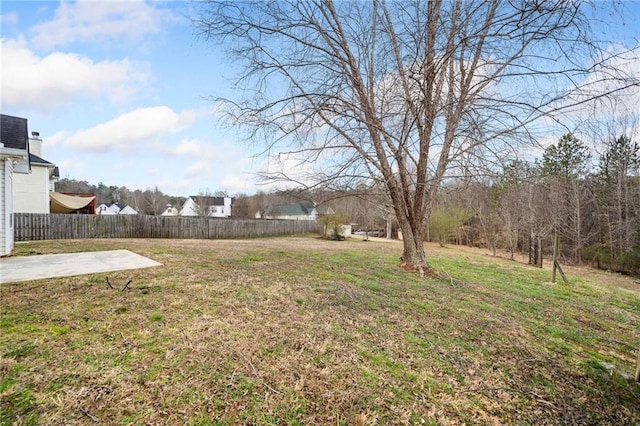 view of yard featuring a patio area and fence