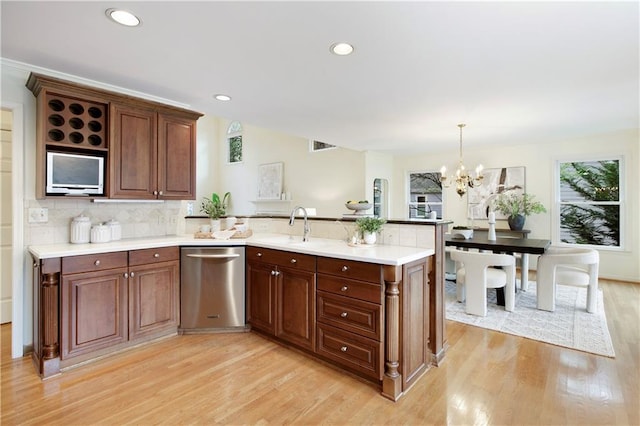 3711 Spinnaker Cir, Alpharetta, GA 30005 - kitchen with stainless steel dishwasher, a peninsula, light wood-type flooring, light countertops, and recessed lighting
