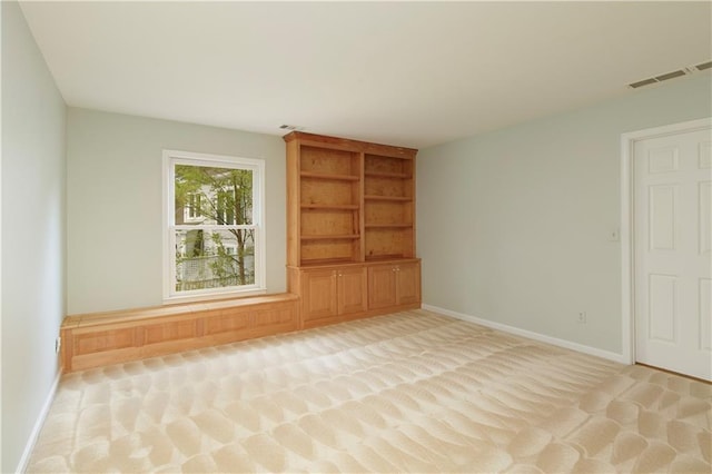 3711 Spinnaker Cir, Alpharetta, GA 30005 - empty room featuring light carpet, baseboards, and built in features