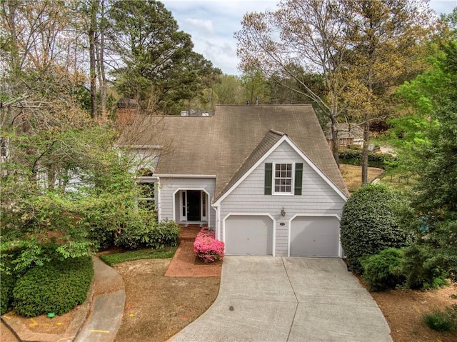 3711 Spinnaker Cir, Alpharetta, GA 30005 - view of front facade featuring concrete driveway, a shingled roof, and a garage
