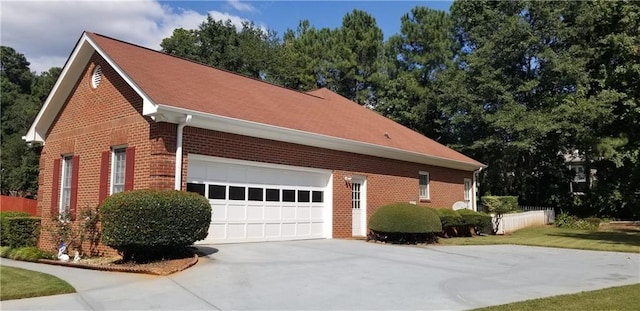 view of property exterior with a garage