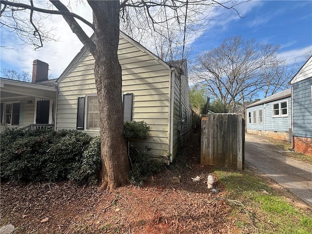 view of side of property featuring a chimney