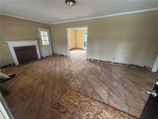 unfurnished living room featuring ornamental molding, wood-type flooring, and a fireplace