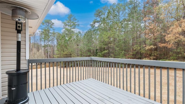 deck featuring a forest view