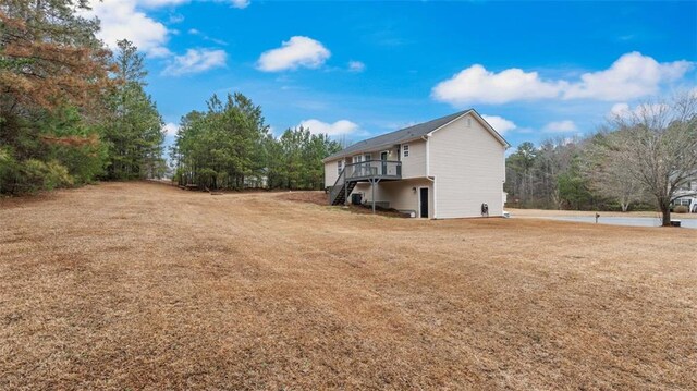 266 Carthage Blvd, Rockmart, GA 30153 - view of property exterior with stairway, a deck, and a yard