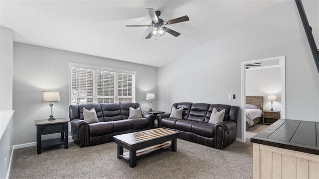 carpeted living area with ceiling fan, baseboards, and lofted ceiling