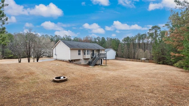 266 Carthage Blvd, Rockmart, GA 30153 - back of house with an outdoor structure, stairway, and an outdoor fire pit