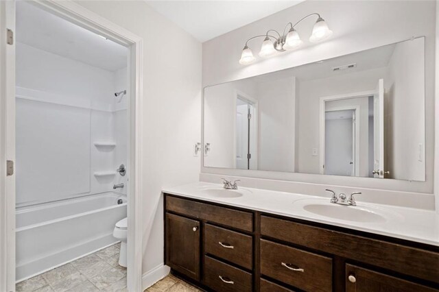 full bathroom featuring vanity, toilet, and shower / washtub combination