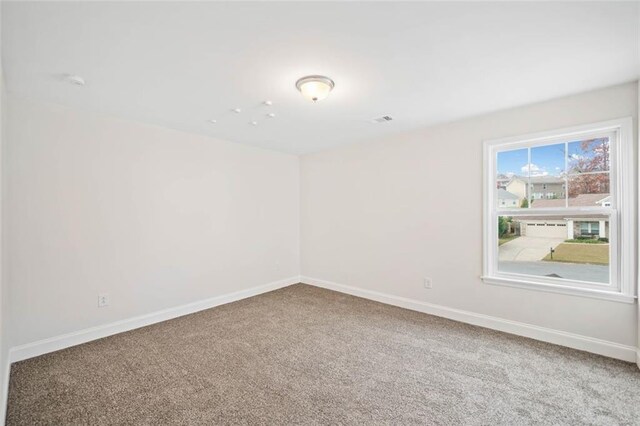 unfurnished room featuring carpet floors