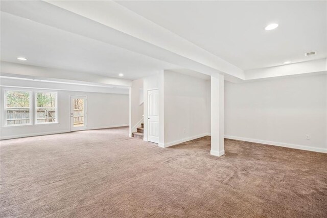 basement featuring carpet flooring