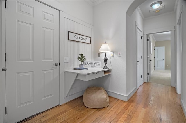 216 Crescent Moon Way, Canton, GA 30114 - hall featuring baseboards, arched walkways, ornamental molding, and light wood-style floors