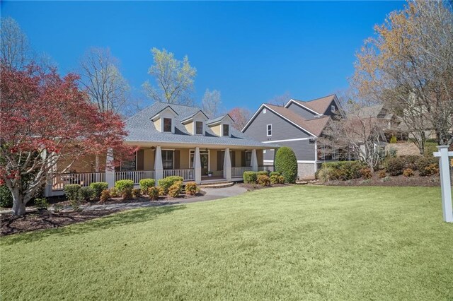 216 Crescent Moon Way, Canton, GA 30114 - cape cod home featuring covered porch and a front lawn
