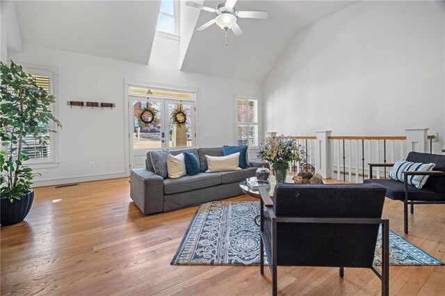 216 Crescent Moon Way, Canton, GA 30114 - living room with high vaulted ceiling, visible vents, ceiling fan, french doors, and wood-type flooring