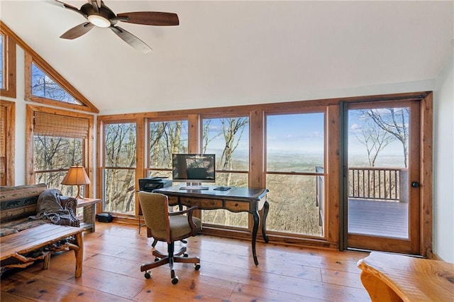 office area featuring a ceiling fan, lofted ceiling, and wood-type flooring