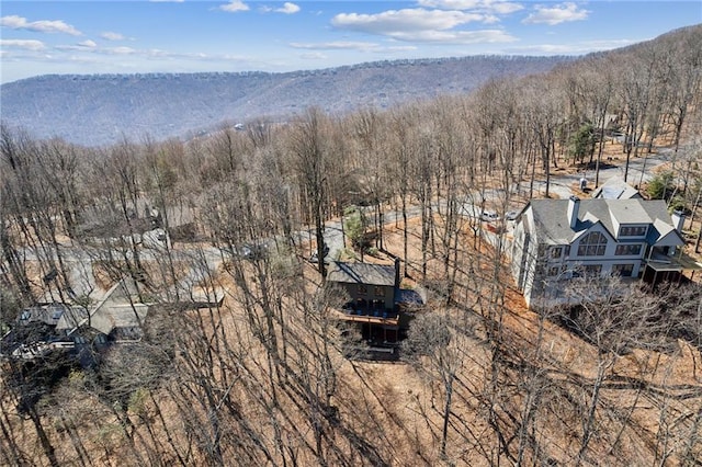 birds eye view of property with a wooded view