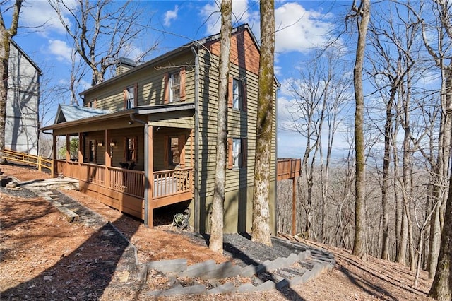 view of home's exterior featuring a chimney