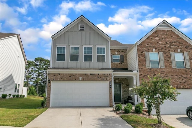 view of front of property featuring a garage and a front lawn