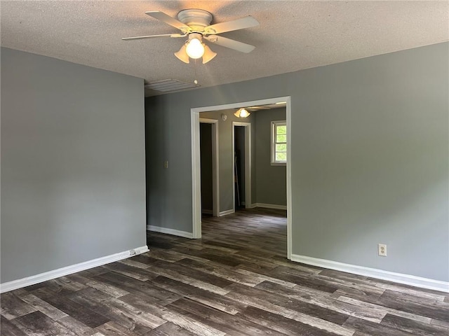 319 Gordon St, Rockmart, GA 30153 - empty room featuring a textured ceiling, ceiling fan, baseboards, and dark wood-type flooring