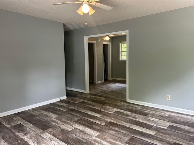319 Gordon St, Rockmart, GA 30153 - empty room with a textured ceiling, a ceiling fan, baseboards, dark wood-type flooring, and visible vents