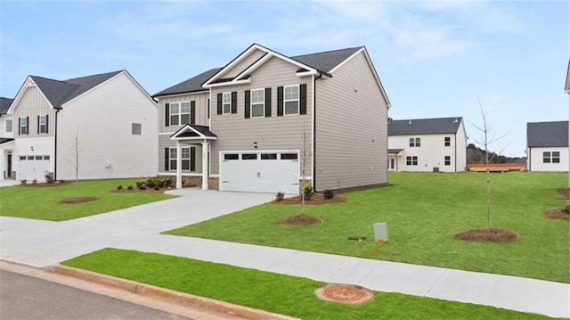 view of front of house with a garage and a front yard