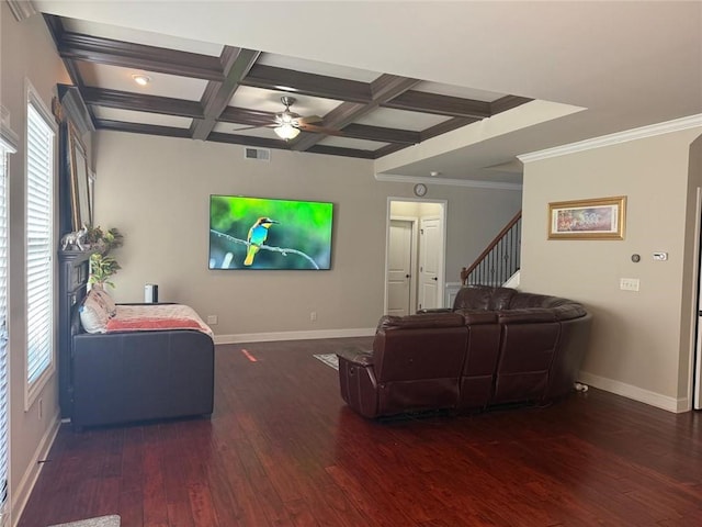living area featuring a ceiling fan, coffered ceiling, baseboards, wood-type flooring, and healthy amount of natural light