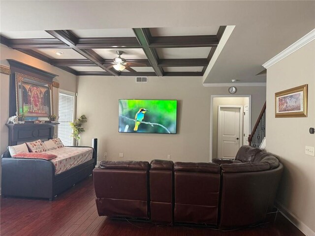 living area with ceiling fan, hardwood / wood-style flooring, beamed ceiling, coffered ceiling, and crown molding