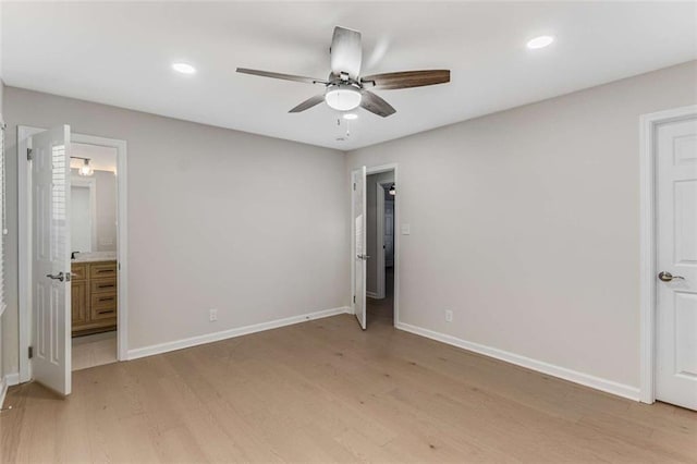 unfurnished bedroom featuring baseboards, recessed lighting, and light wood-style floors