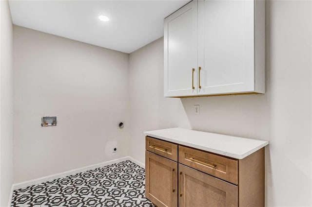 laundry area with washer hookup, baseboards, cabinet space, tile patterned floors, and electric dryer hookup