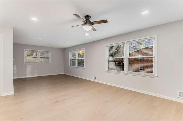 empty room with light wood-style floors, ceiling fan, baseboards, and recessed lighting