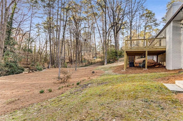 view of yard featuring a deck and stairs