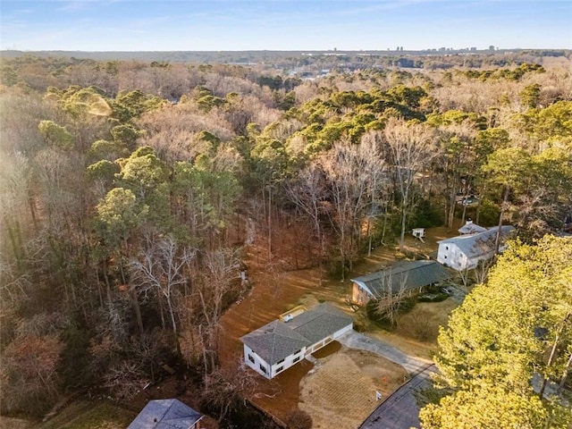 drone / aerial view featuring a view of trees