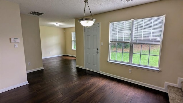 4707 Golod Way, Lithonia, GA 30038 - entrance foyer with dark wood finished floors and a textured ceiling