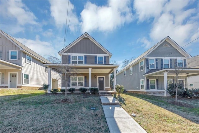 view of front of home with a front yard and a porch