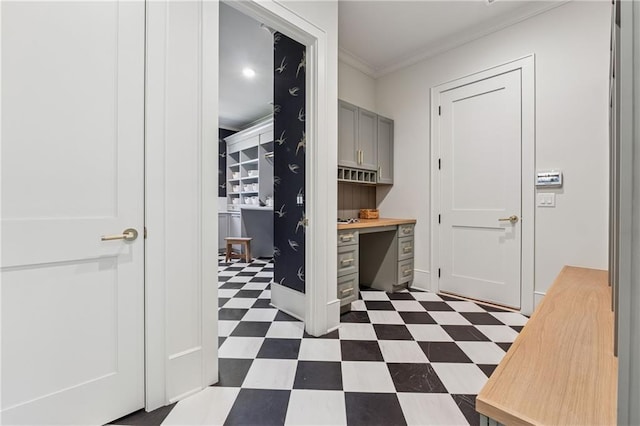 interior space with ornamental molding and dark floors