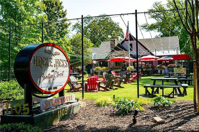 view of home's community with a yard