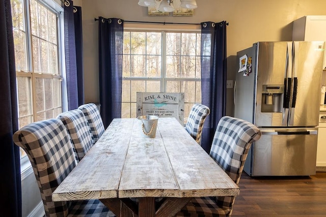 dining space featuring dark hardwood / wood-style floors