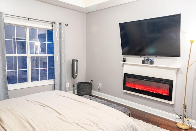 bedroom featuring dark hardwood / wood-style flooring