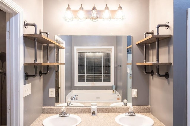 bathroom with a tub to relax in and vanity