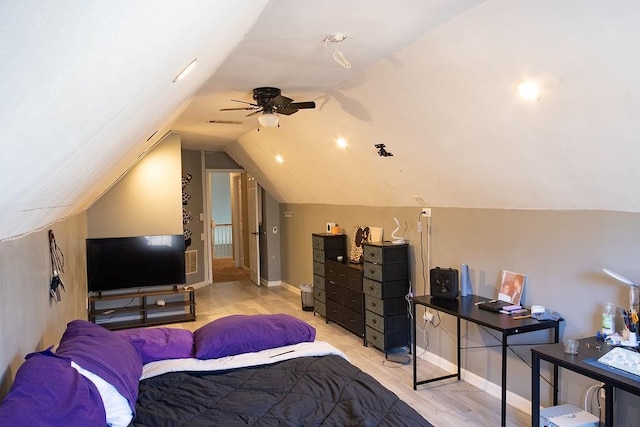 bedroom featuring vaulted ceiling and light hardwood / wood-style floors