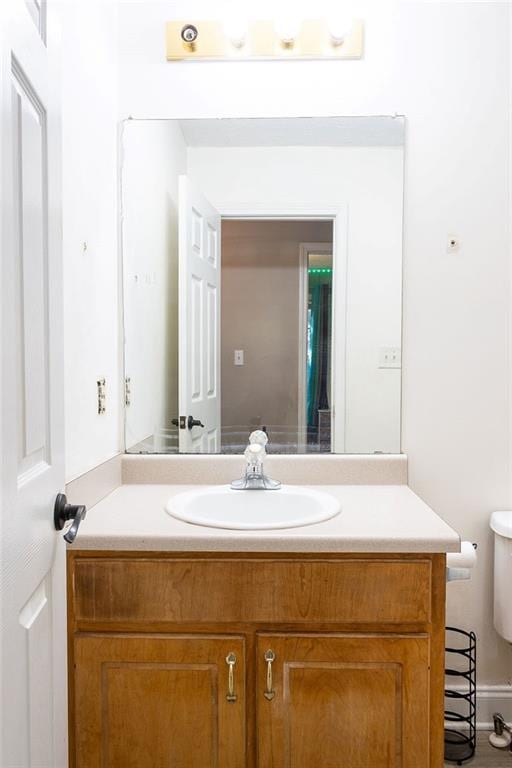 bathroom with vanity and toilet