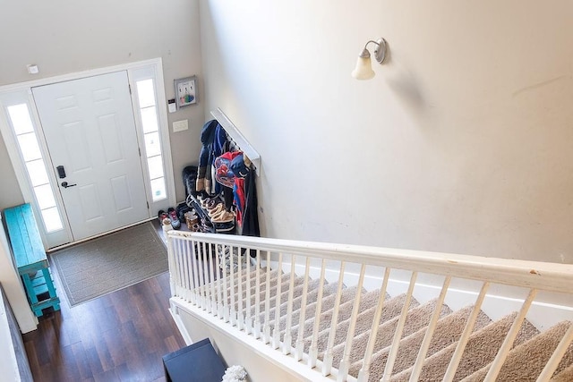 foyer with dark hardwood / wood-style floors