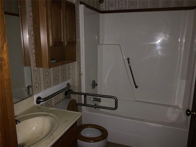 full bathroom with toilet, vanity, and tub / shower combination