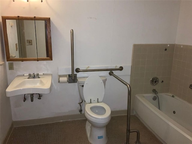 bathroom with tile patterned floors, toilet, and sink